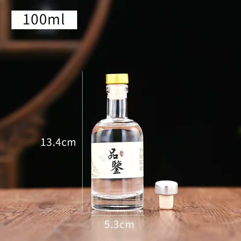 Botella de vidrio de vodka de alta calidad botella de vino de fruta cristal transparente de arena blanca dividida botella vacía con película de retracción térmica en stock