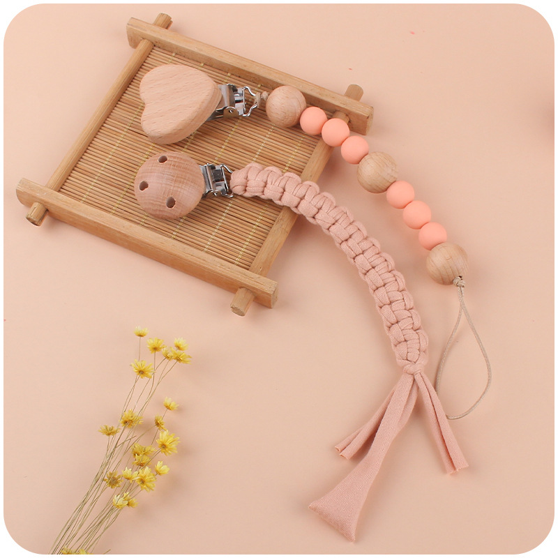 Nuevos suministros para bebés Beech Love Clip calmante bebé tela de algodón anti-gota Cadena de silicona perlas pezón cadena traje