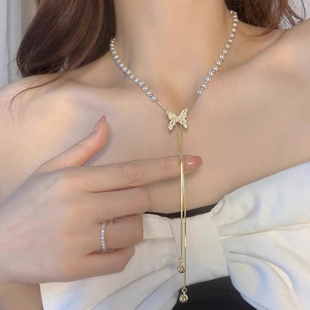 Collier de perles à tirer pour femme, chaîne ras du cou à pompon papillon haut de gamme et polyvalente, chaîne tendance unique pour pull_voghion.com