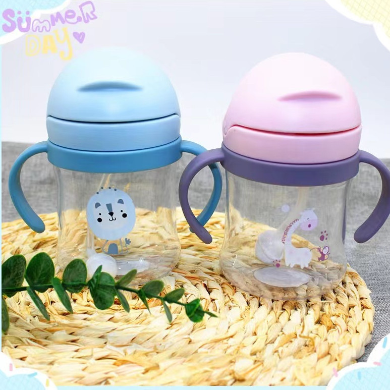 Bebé de dibujos animados mango taza de agua Flip niños paja taza de agua con bola de gravedad bebé beber taza Madre y niño al por mayor