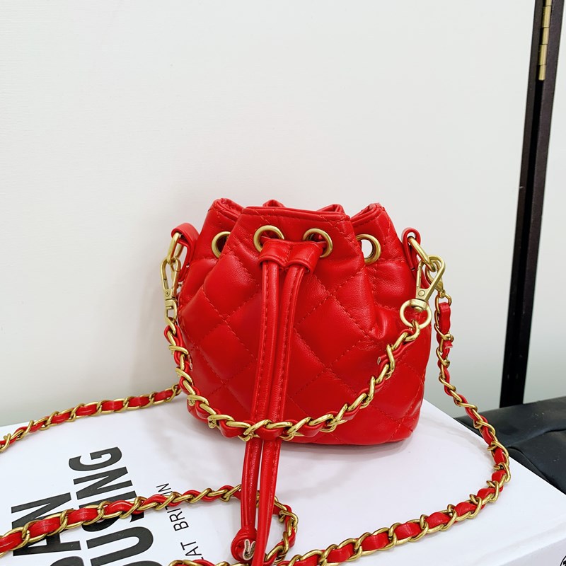 Bolso de hombro para niños y niñas Lingge de moda, cordón de aire extranjero, bolso de cubo de bebé de color sólido simple, nuevo bolso de cadena para niños