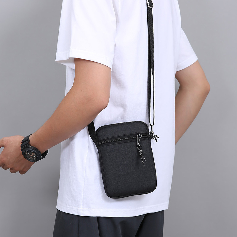 Comercio exterior nuevo bolso de hombro portátil ligero para hombres bolso de lona de teléfono móvil casual simple bolso de moda al aire libre con bolso de mochila