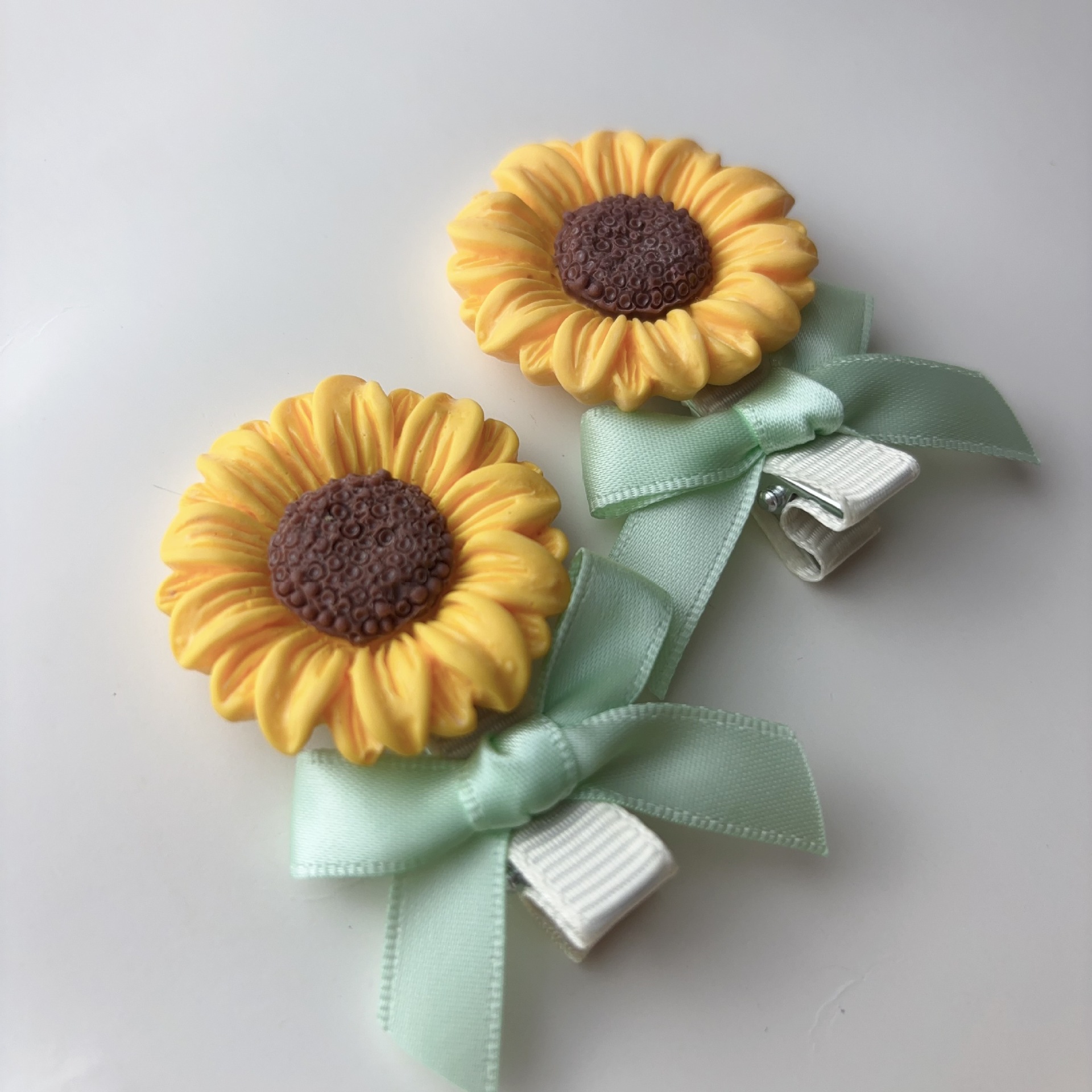 Fermaglio per capelli con fiocco e girasole stile foresta_voghion.com