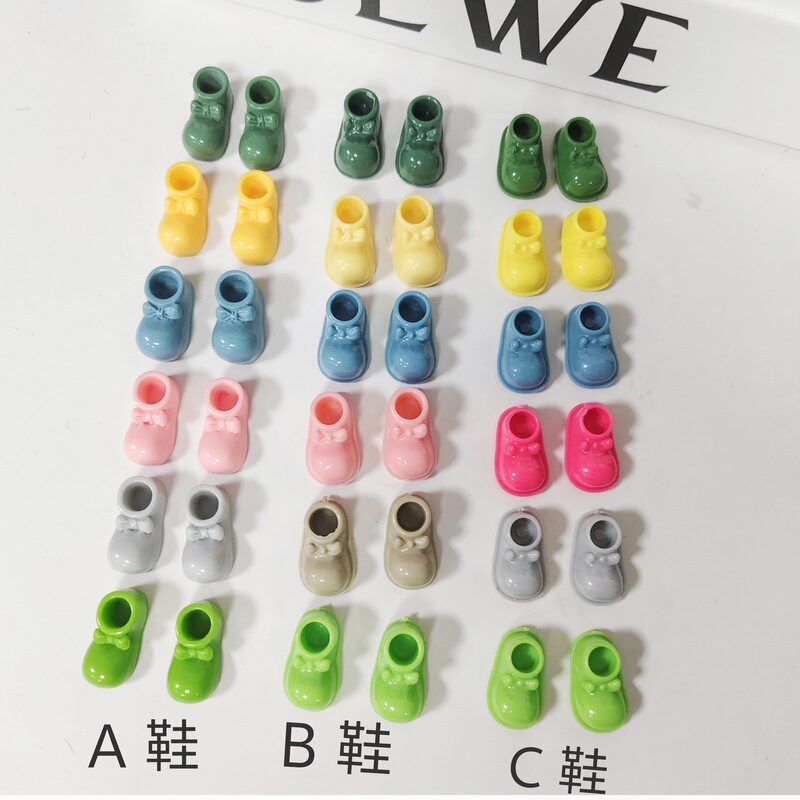 Factory resin bow boots ABC three price fur ball jewelry accessories mobile phone case headdress hole shoes accessories