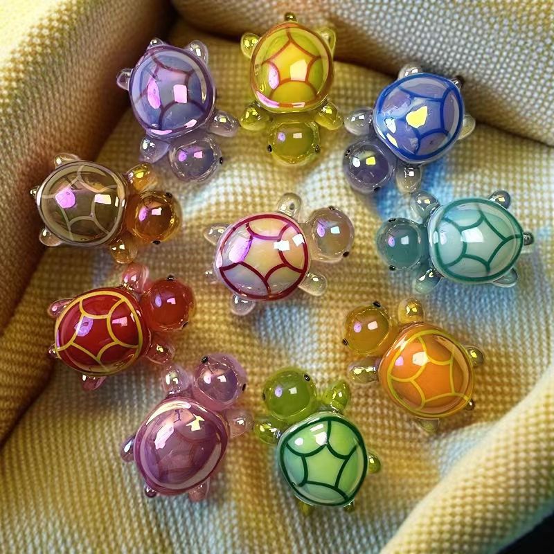 Galvanoplastia de color luminoso tortuga celebridad de la red tortuga bolsa ciega resina accesorios de dibujos animados resina bricolaje decoración de coche péndulo X20