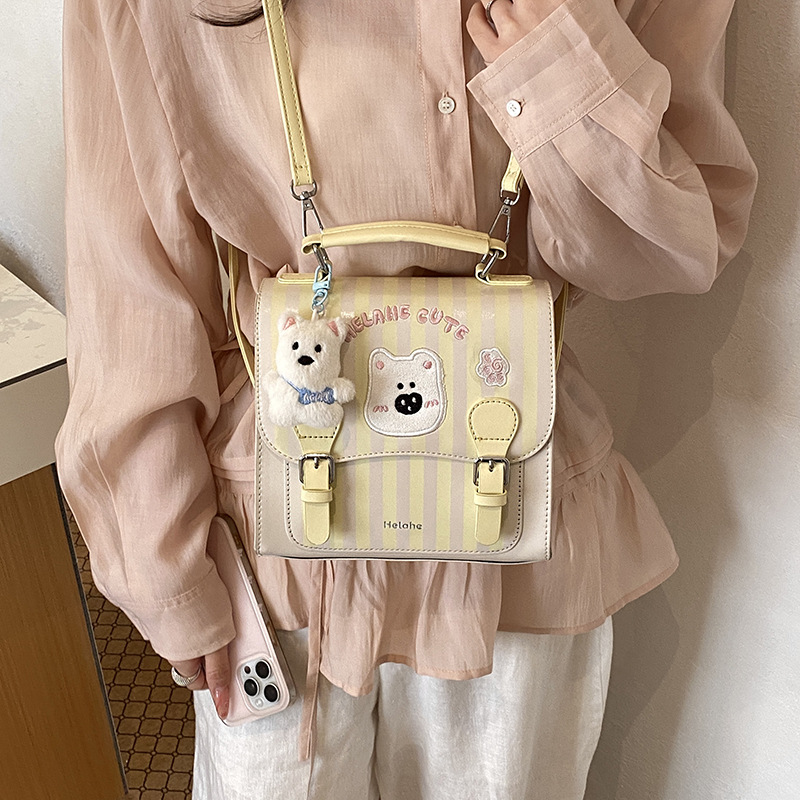 Caricatura encantadora oso, mochila para niños y niñas, mochila para niños a rayas extranjeras, nueva mochila coreana para padres e hijos.