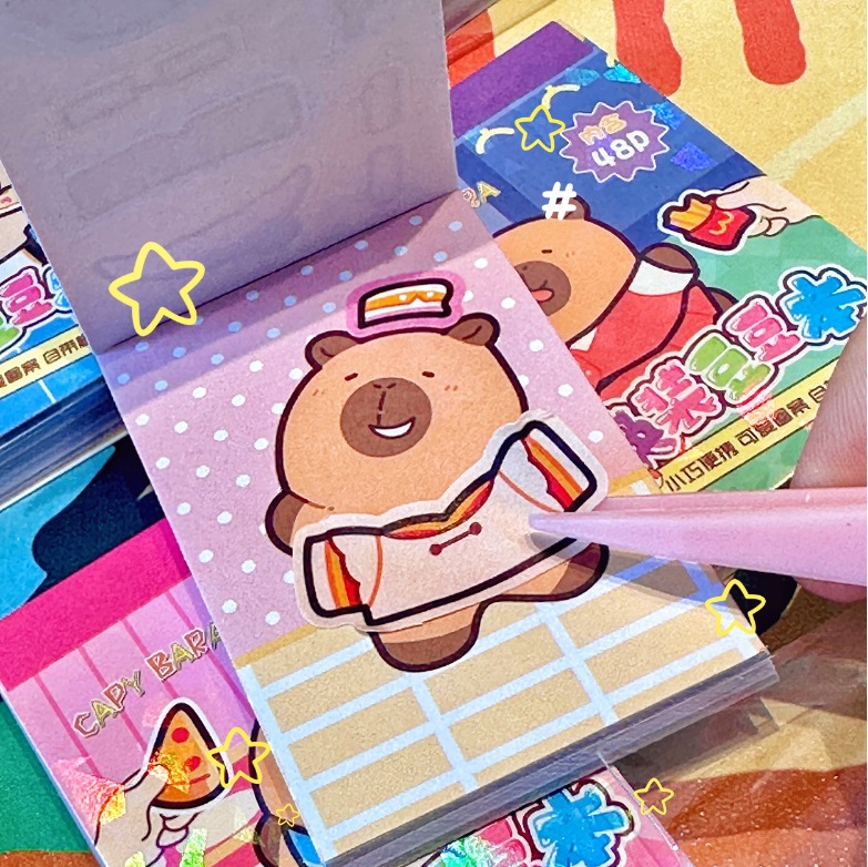 Nuevo caliente venta Capibara cambio de ropa Bean Bean Book creativo DIY San Li Gao pintura cambio de ropa 2 en 1 libro de bolsillo