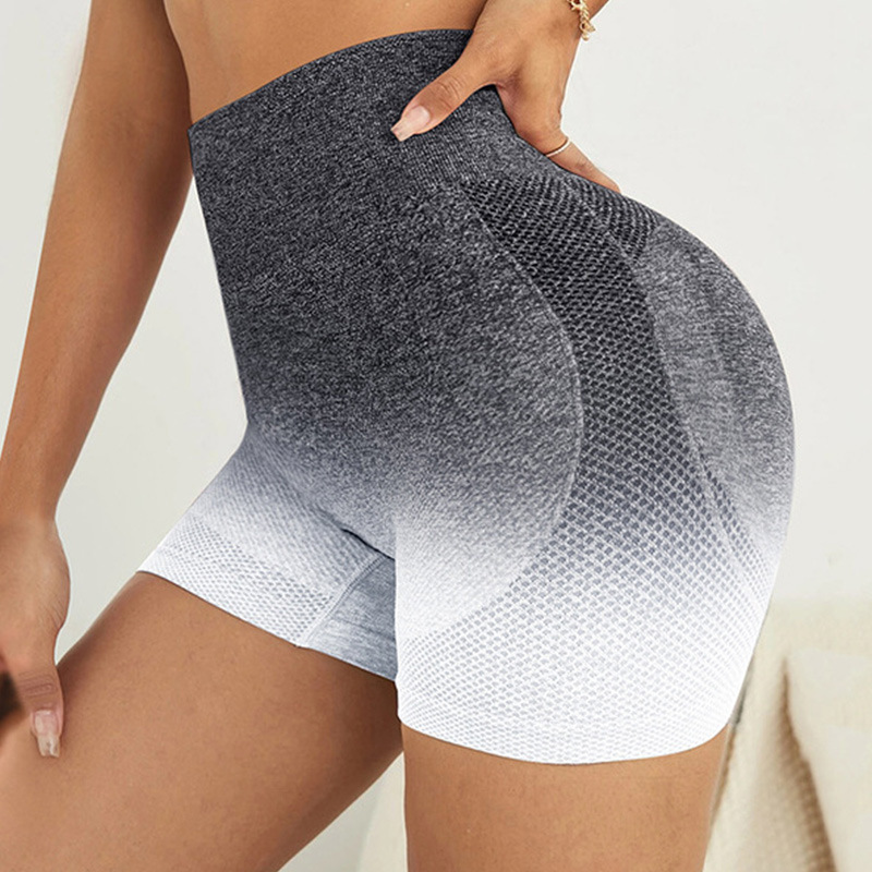 Pantalones cortos de yoga sin costuras teñidos con gradiente transfronterizo europeo y americano transpirables de las mujeres de secado rápido Melocotón Cadera apretada cintura alta estiramiento tres puntos