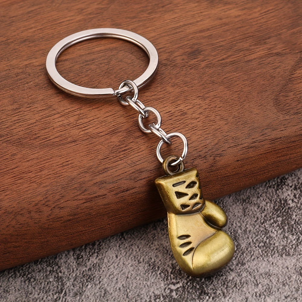 Serie de oro de aleación de venta transfronteriza caliente fútbol béisbol rugby sombrero hechicero puño llavero colgante mochila