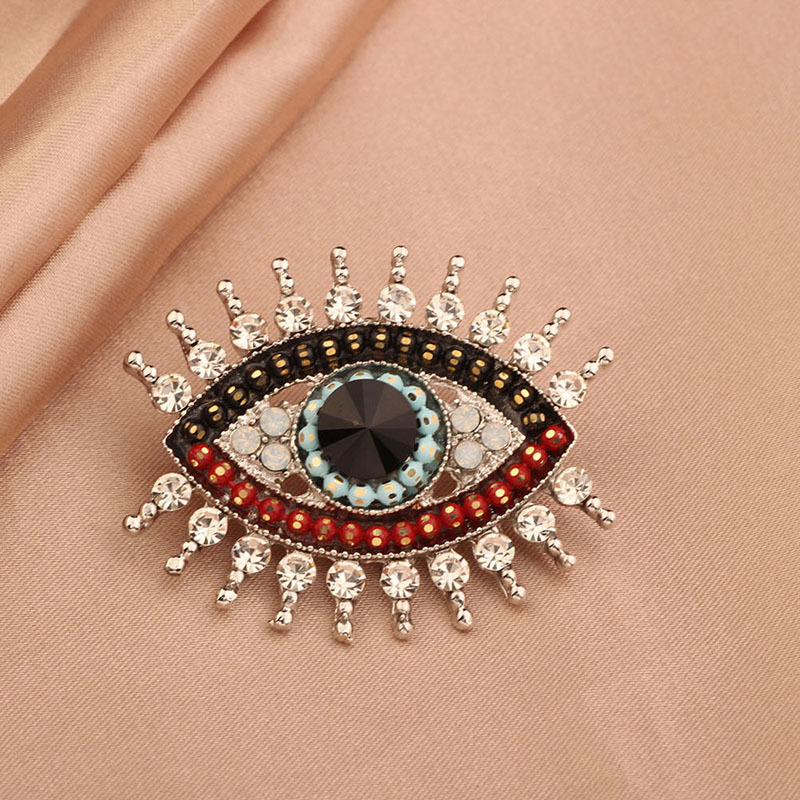 Retro simple Ángel ojo en línea broche de celebridad diamante femenino francés diablo ojo pecho ornamento