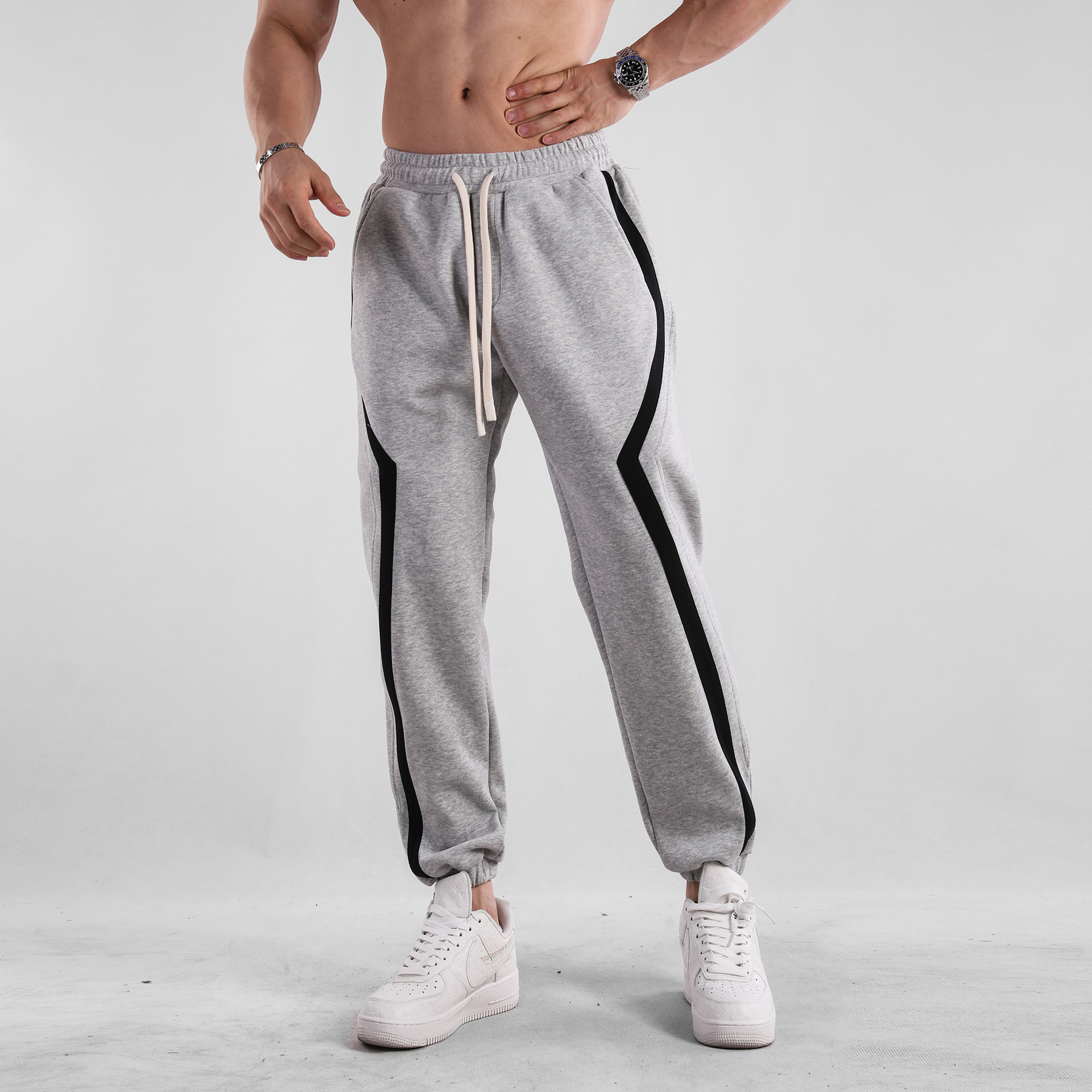 Otoño e Invierno a rayas americano casual deportes europeo y americano más tamaño pantalones sueltos pantalones de chándal muscle hombres deportes nueva moda