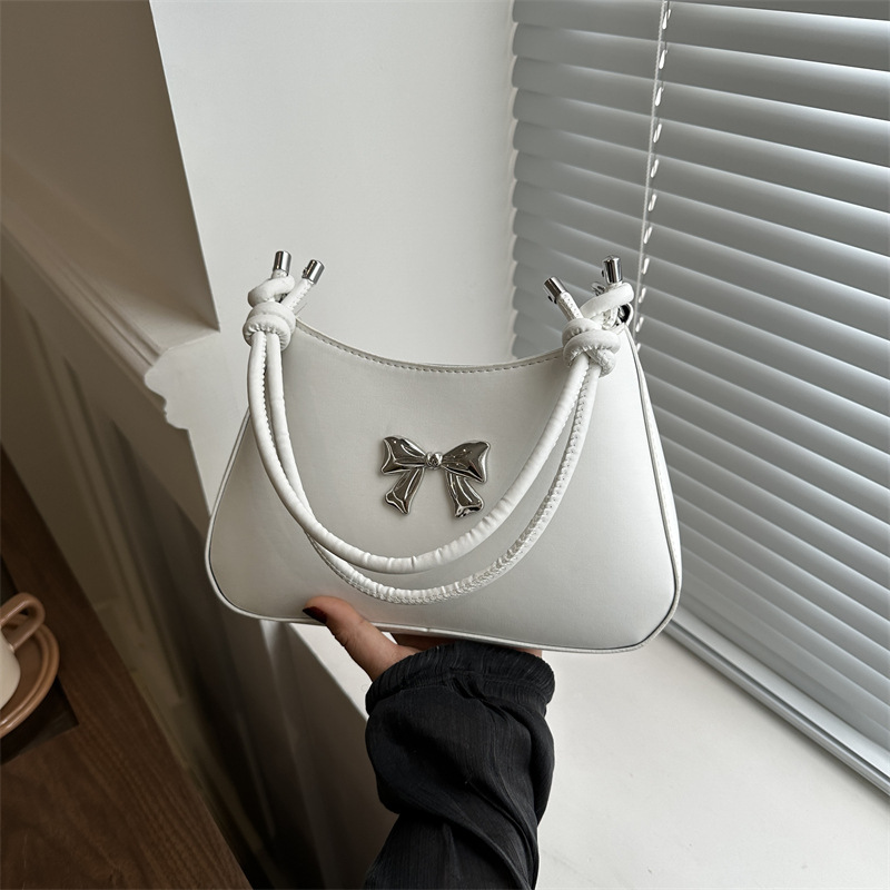 Bolso de mano de arco dulce para mujeres 2024 nueva moda coreana color caramelo brazo mochila cadena bolso de hombro