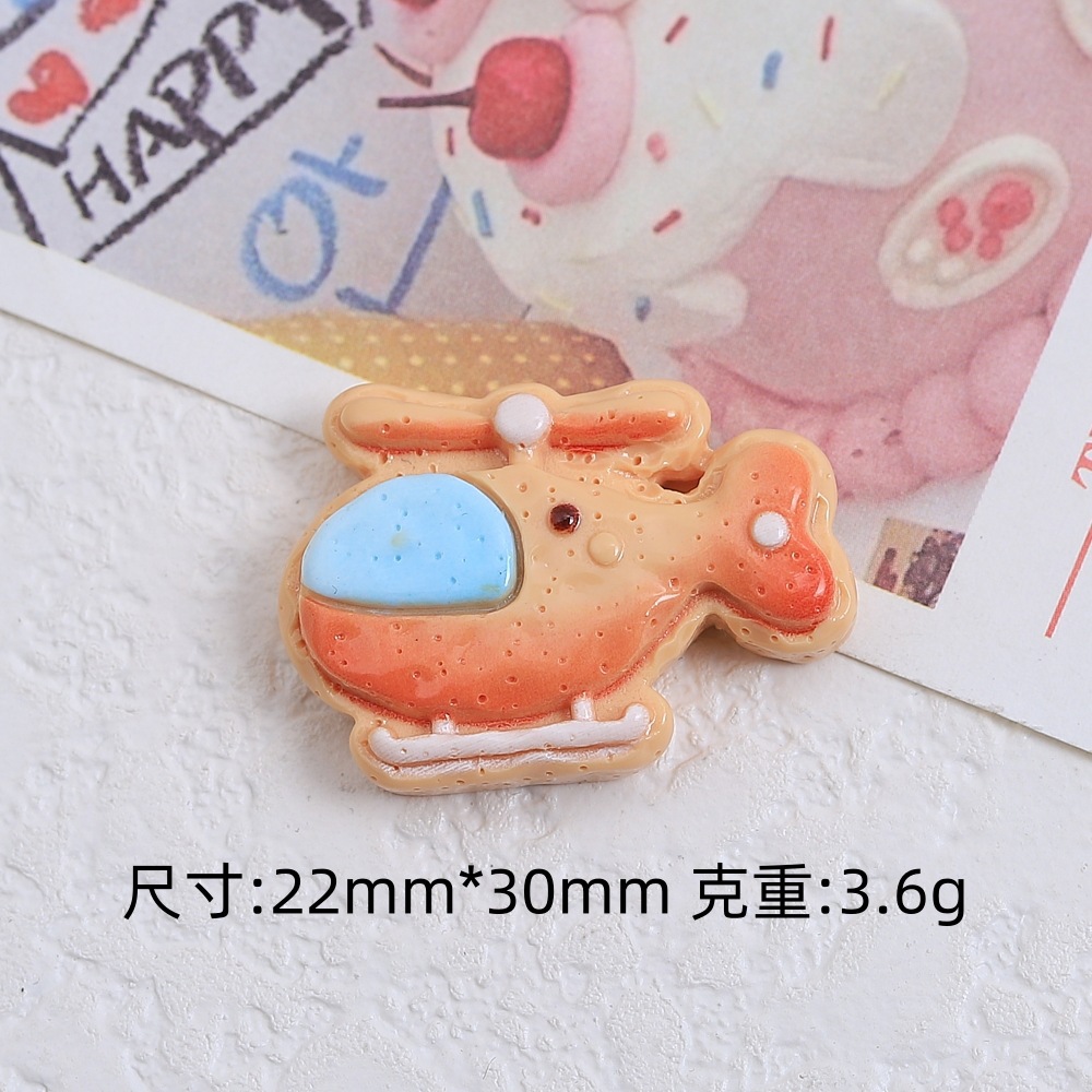 漫画の掘削機のビスケットの食事はdiyクリームゴムの樹脂の小さい部品の穴の靴のボタンのアクセサリーの材料を遊んで卸売りを包みます。