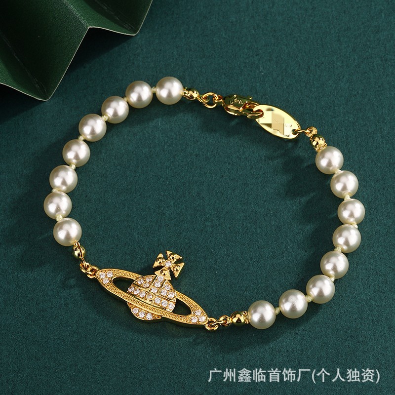 西太后のブレスレットの土星のピンの真珠のブレスレットのクリップのフルダイヤモンドの手の装飾のビビアンの百合の工場は卸売りします。
