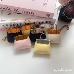 新しいベルベットのフロスト革のミニバッグは高級感のある小さなバッグのキーホルダーを掛けています