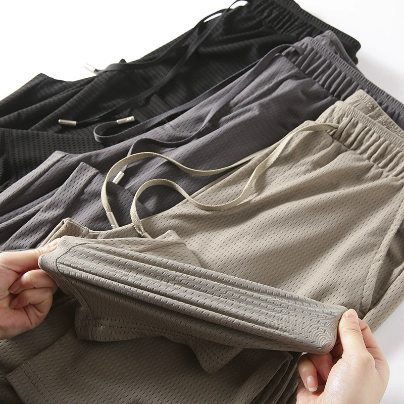 Настоятельно рекомендуется! Ice Silk Кондиционер "S штаны"! Летние мужские большие эластичные дышащие повседневные брюки с лазерной перфорацией