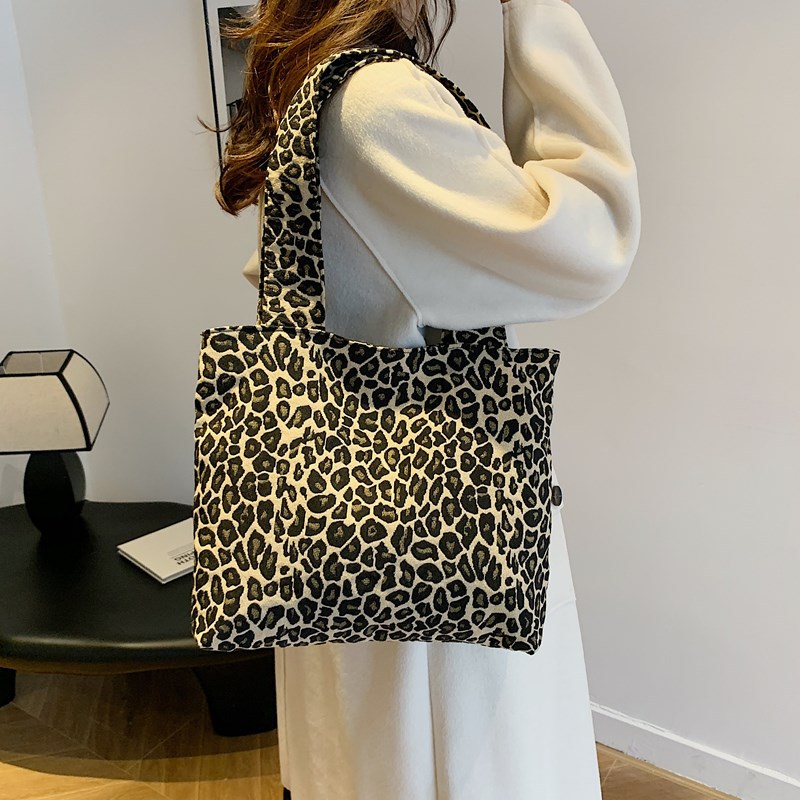 Bolsa de lona de leopardo para mujeres 2024 nuevo otoño y invierno ocio versátil mochila de hombro de viaje tote