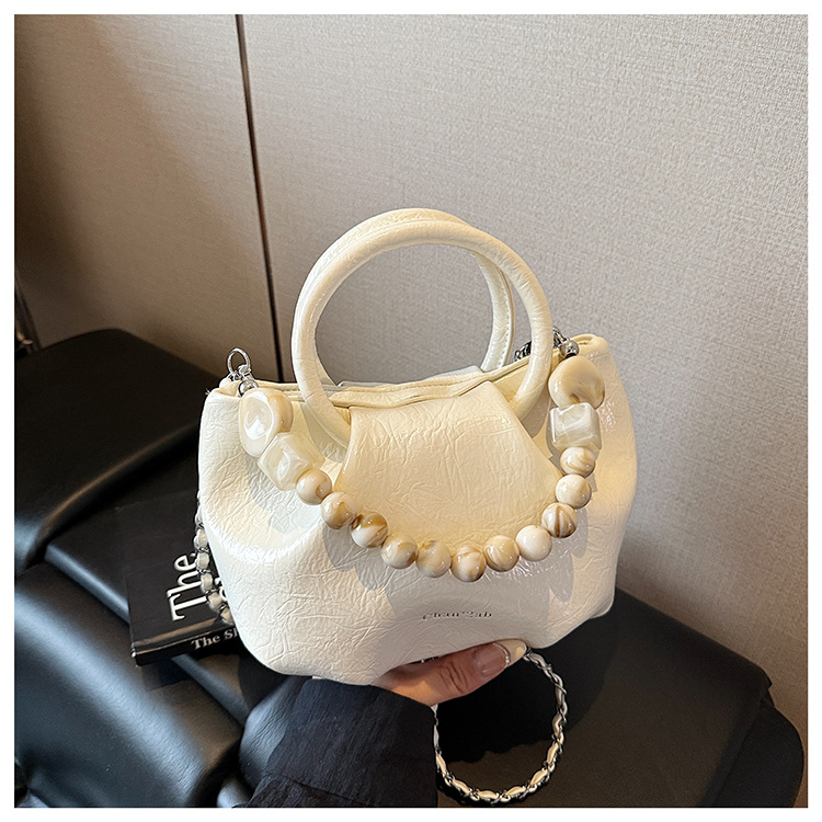 A stylish and trendy beaded bag for women, a new summer chain crossbody cloud bag for women in 2025 undefined