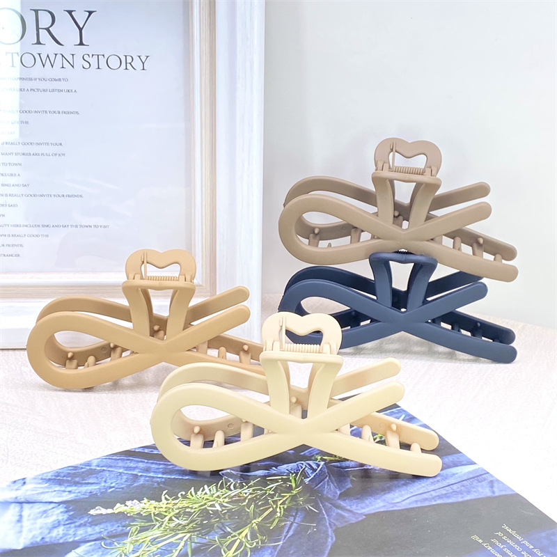 Pintura de caucho de alta calidad de plástico de tamaño grande y mediano tamaño pequeño agarre leche té color horquilla hacia atrás cabeza agarre 2 yuanes supermercado accesorios para el cabello