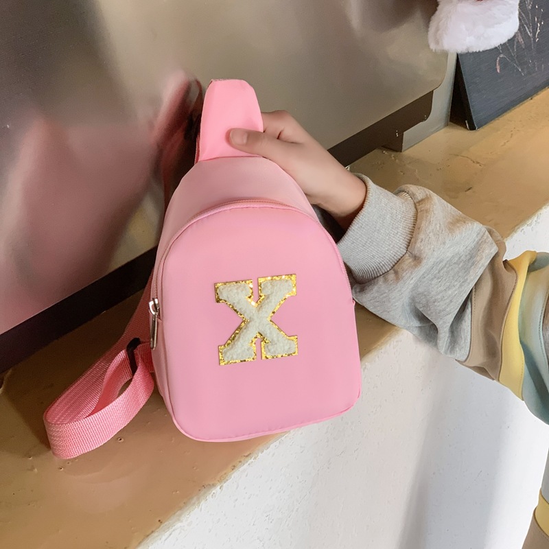 2026 nueva bolsa de niños 26 letras inglesas bolsas de pecho de color sólido para niños y niñas bolsas de mini bebé ligeras
