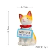 Sitting cats hanging billboards