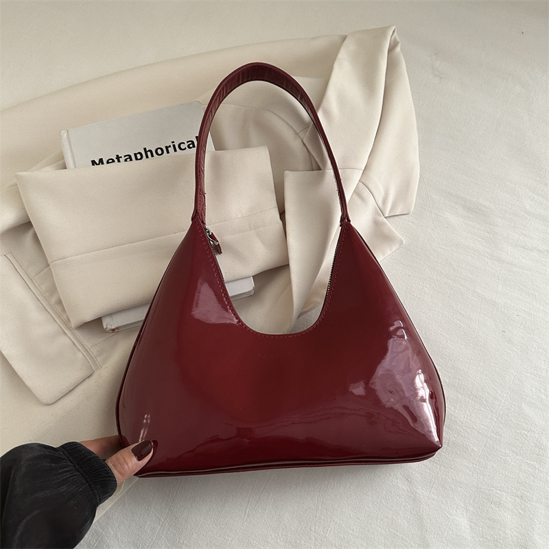 Moda casual axila media luna bolso de mujer charol bolso de hombro portátil estilo caliente Europa y América retro brillante sensación de alta gama