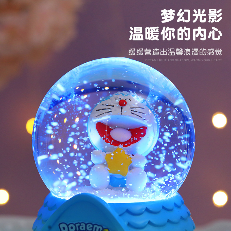 Nueva bola de cristal Doraemon Jingdang gato caja de música automática nieve azul claro grasa regalo de vacaciones