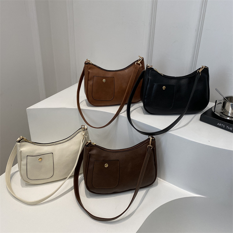 Bolso de mujer retro coreano personalidad 2025 bolso de media luna de hombro de estilo nuevo estilo francés bolso de diseño de nicho bajo la axila