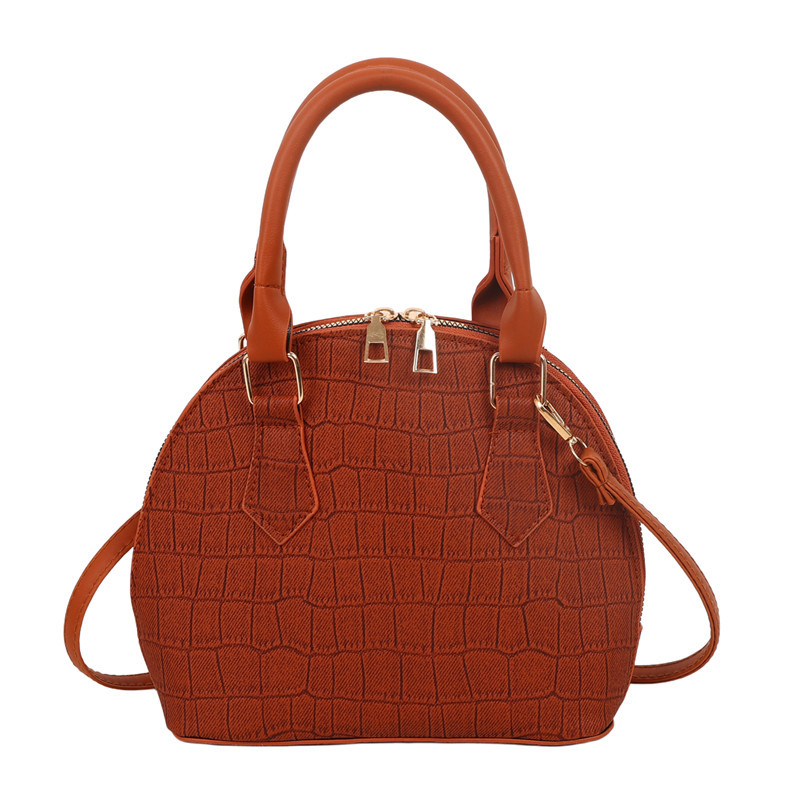 Bolso de mano de piedra para mujeres 2024 nuevo bolso de concha de textura bolso de hombro de moda minimalista estilo elegante mochila