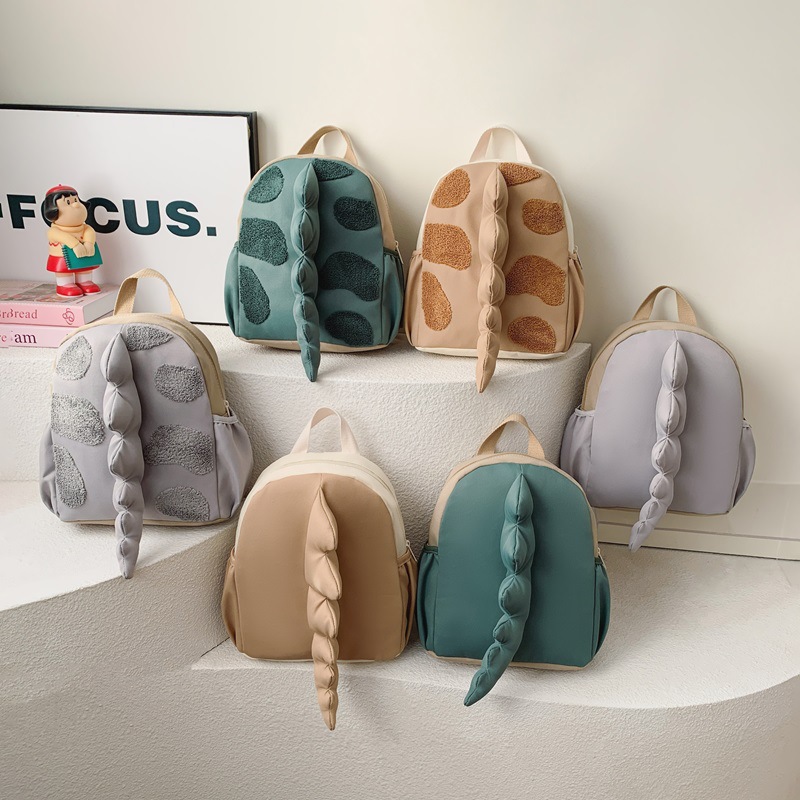 Mochila infantil transfronteriza de dibujos animados lindos dinosaurios cola mochila para niños y niñas jardín de infantes pequeña clase mochila para niños