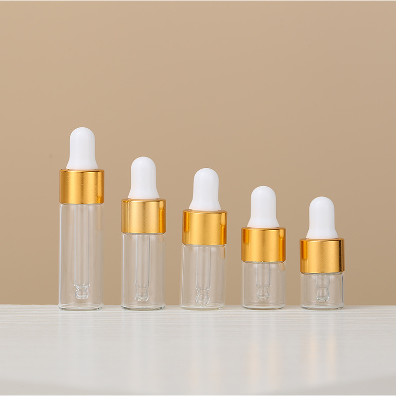 1ml una pieza 3528; botella transparente con anillo de oro; vidrio