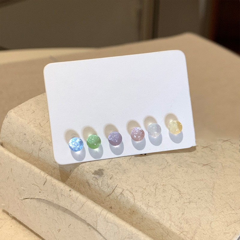 Pendientes redondos de color de aguja de plata Pendientes frescos y dulces Pendientes de todo fósforo de moda simple para mujer