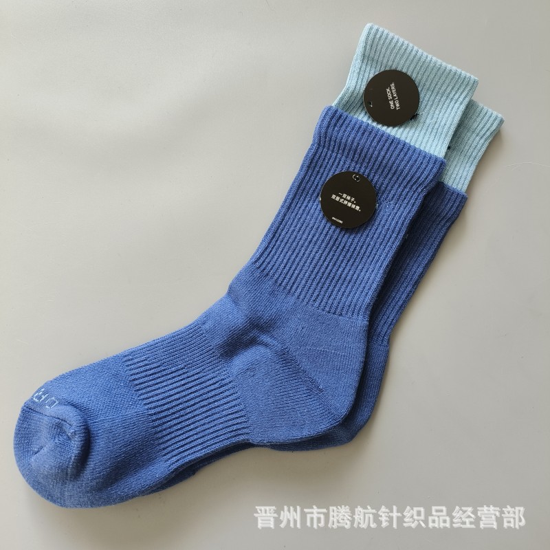 蘇万ナイキの靴下のカラーの二重は男女の中で長い筒のタオルの底のスポーツの靴下をつなぎ合わせてバスケットボールの靴下を走ります。