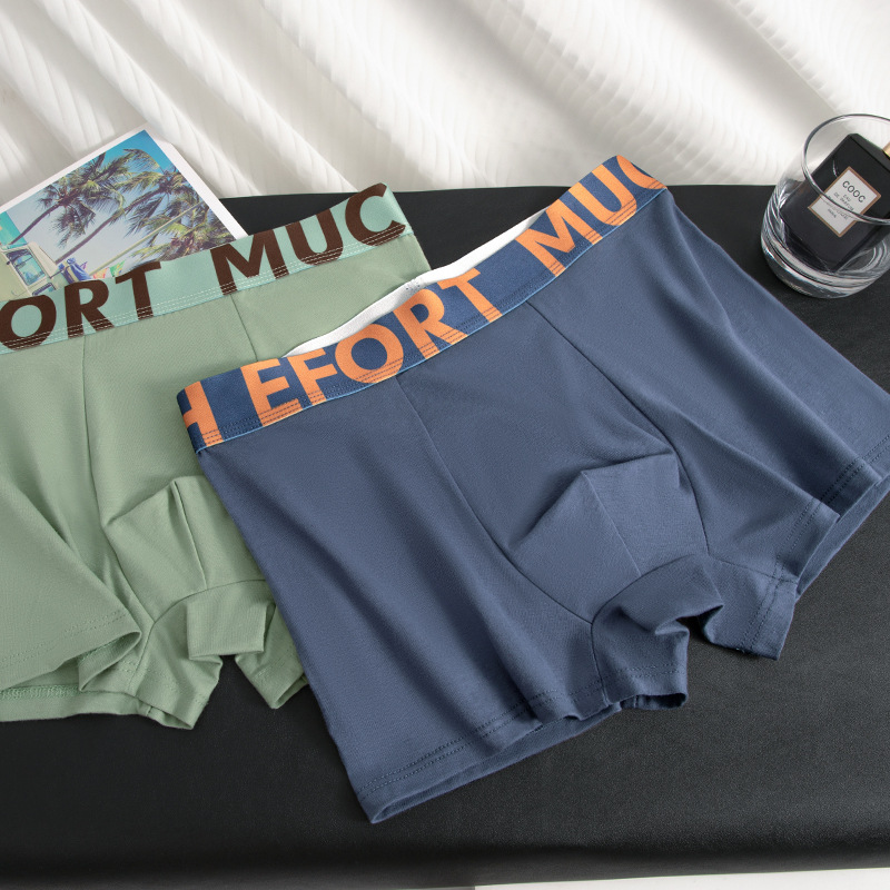 Ropa interior de hombre de algodón de nuevo estilo, antibacteriano y transpirable, calzoncillos con letras personalizadas, calzoncillos bóxer de hombre de tendencia de cintura media al por mayor