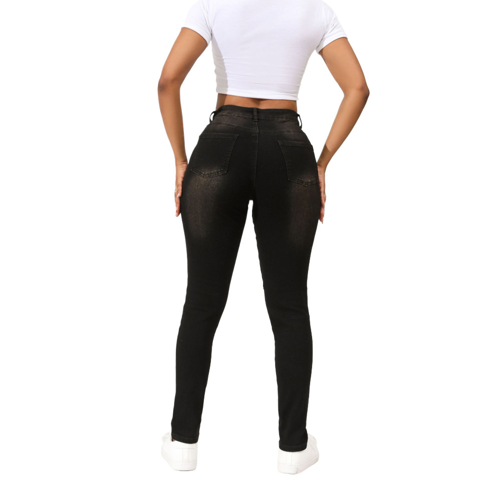 Vaqueros negros rasgados estilo europeo y americano para mujer, pantalones ajustados elásticos de cintura media que hacen que las piernas parezcan más delgadas, en stock para dropshipping.