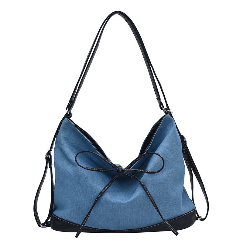 Bolsa de lona de nicho coreana para mujeres 2024 nueva moda de transporte de doble uso mochila de hombro universal