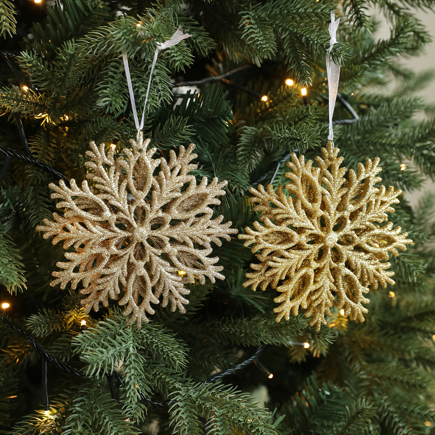 Colgante de árbol de Navidad transfronterizo polvo de oro copo de nieve plástico hueco tridimensional diseño de decoración de Navidad doble cara