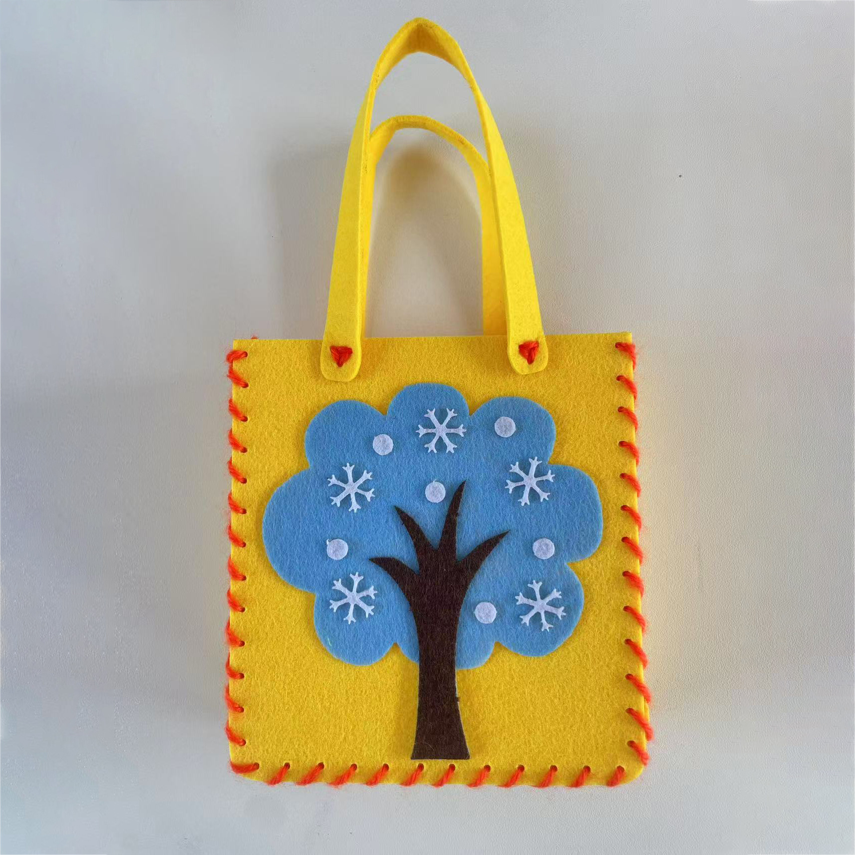 Jardín de infantes bolsas hechas a mano DIY bolsas de tela no tejida material de hacer juguetes creativos para niñas al por mayor