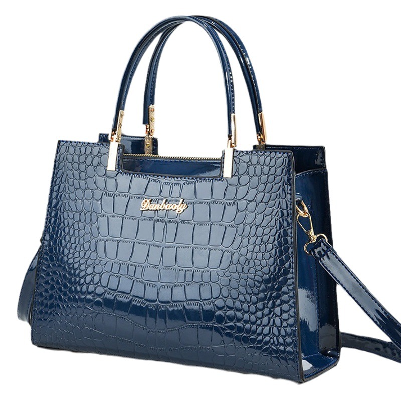 Bolso de mamá versátil de moda 2025 verano nuevo bolso de mano de moda para mujeres de mediana edad popular bolso de hombro y bandolera.