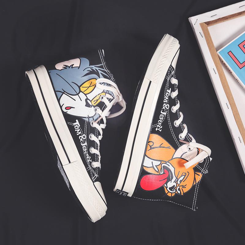 Zapatos de hombre caliente zapatos de skate 2025, cuatro temporadas nuevas zapatos de lona de gato y ratón de alta altura, tendencia de moda casual para hombres.