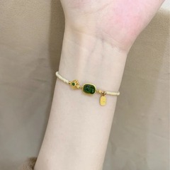 新しい中国式の吉祥如意の小さいピシュピストのブレスレットの女性の金の軽豪華な大衆は新しい中国式の高級感の手串の装飾を設計します。