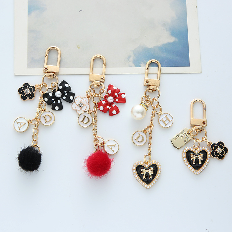 keychain with bow pearl with letters