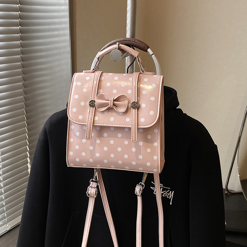 Cute arco ondulado punto PU mochila estilo universitario multifuncional mochila de hombro 2026 nueva mochila de mujer