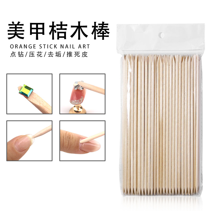 Herramientas de manicura al por mayor palo de madera de naranja palo de madera empuja la piel muerta 100 palos de madera de naranja de doble punta en bolsas