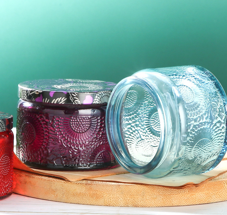 复制_圆形玻璃香薰蜡烛杯太阳花浮雕家居罐带盖子.jpg