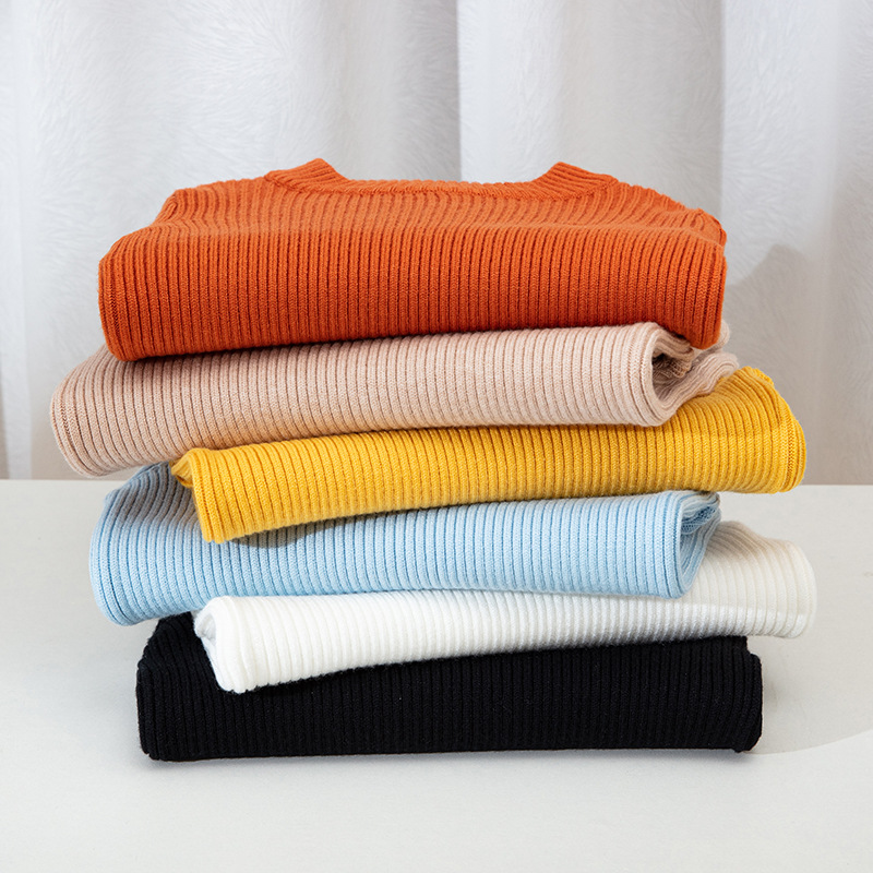 Suéteres infantiles 2025, nuevo estilo de otoño e invierno, ropa interior de punto para niños y niñas, suéter de cuello redondo versátil de color liso.