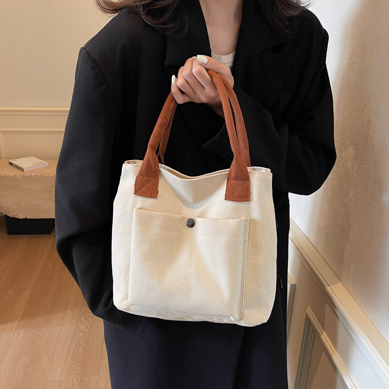 2024 nuevo bolso de lona para mujeres tela japonesa retro simple versátil Harajuku bolso de mano de color sólido casual de moda para mujeres