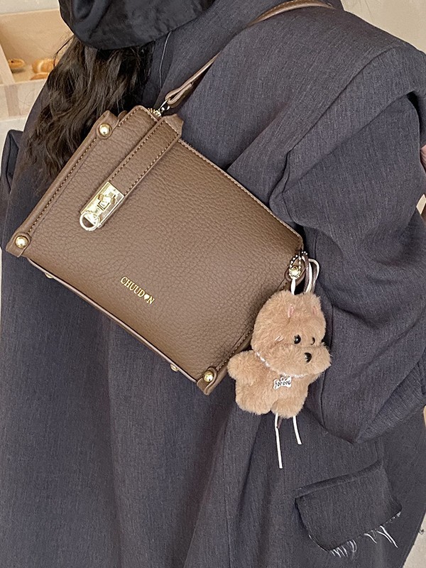 Bolsos retro retro de alta calidad para mujeres 2026 nueva textura lichi bolso pequeño estilo coreano simple mochila de hombro