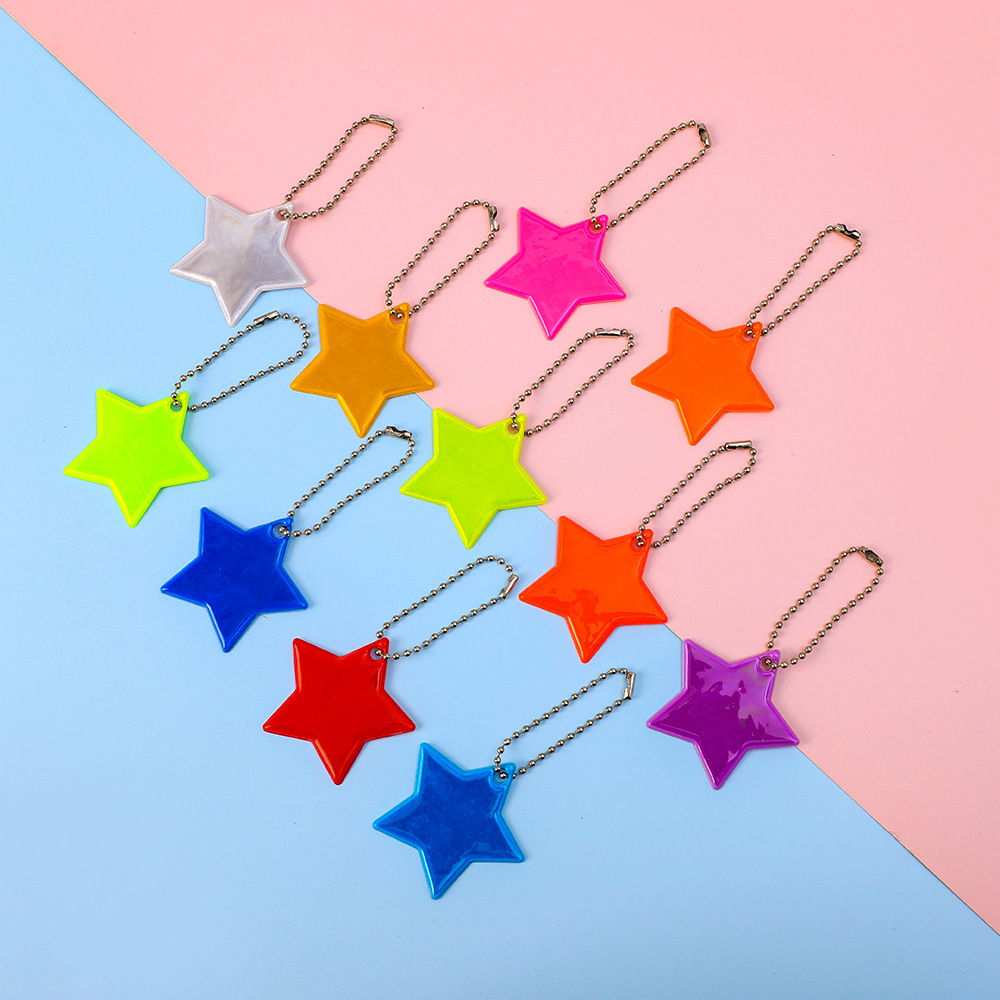 Mochila reflectante colgante creativo PVC estrella llavero noche señal de advertencia montar adornos reflector