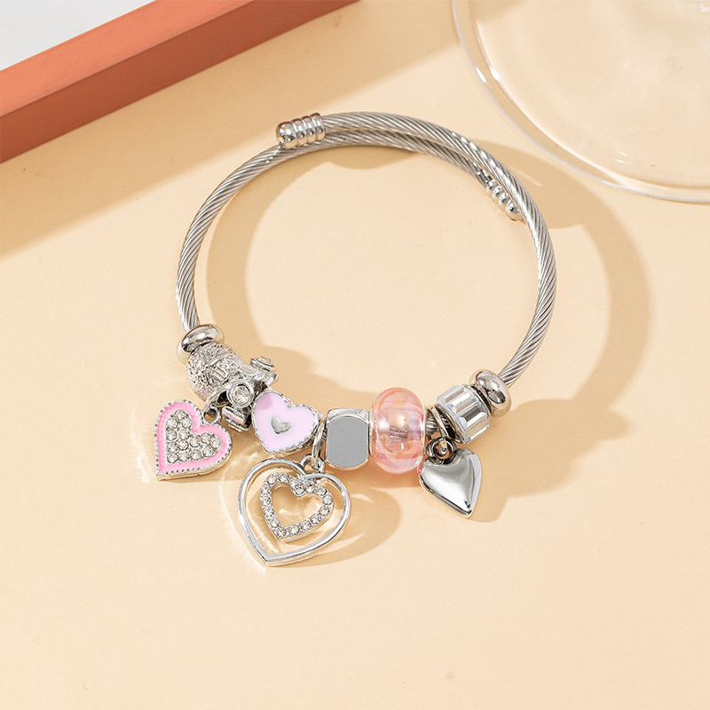 Panjia pulsera Dora DIY cuentas explosivas transfronterizas color rosa goteo amor colgante cuentas de cristal pulsera de acero en forma de corazón